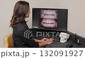 The dentist shows the patient photo of his jaw. Panoramic shot of diseased teeth on the screen at the dentist 132091927