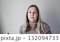 Thoughtful asian adult female engages with smartphone, ponders new message 132094733