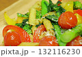 Italian-style dish of stir-fried tomatoes, komatsuna, and pasta 132116230