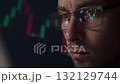 Close up of focused crypto investor watches the fluctuating crypto prices 132129744