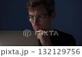 Thoughtful trader analyzing stock market data on laptop  132129756