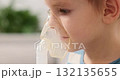 Child Using Nebulizer for Respiratory Treatment at Home 132135655