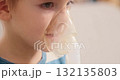 Child Using Nebulizer for Respiratory Treatment at Home 132135803