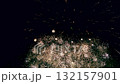 Vibrant multi tier fireworks display lighting up the night sky with golden sparks, pyrotechnic display 132157901