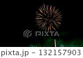 A single firework shooting up to the night sky and followed by an extravagant series of simultaneous explosion display 132157903