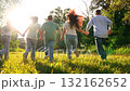 Mother father child kid run towards sunset park, happy family, running dad mom girl boy son daughter, group people run holding hands, one bright path, weekend escape in the countryside, unity in 132162652