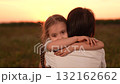 Mother child comforting sad daughter at sunset, emotional family moment outdoors, girl child kid hugging mom after a long day, loving embrace nature, parent child support during hard times, expressing 132162662