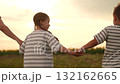 Family girl boy mother father walking field sunset, Happy family outdoors, Parents children girl boy mother father together nature, Family time countryside, Four people holding hands, Rear view family 132162665