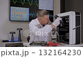 Engineer Inspecting Computer Components in Modern Laboratory 132164230