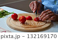Woman cutting and preparing vegetables at home in the kitchen. Concept for cooking and food preparation. 132169170