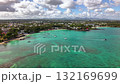 Panoramic Seascape Capturing Emerald Waters Dotted With Vessels and Framed By Dramatic Sky 132169699