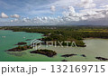 Mauritius Anse la Raie lagoon aerial panorama with mangroves black lava islets boats and calm turquoise water 132169715