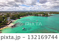 Resort Beach Town with Shallow Lagoon and Distant Mountain Range 132169744