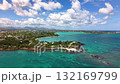 Spectacular Bird's Eye Perspective Of Island Community Surrounded By Crystal Clear Gradient Waters 132169799