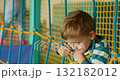 Child Playing in Indoor Playground with Rope Netting 132182012