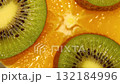 Slices of orange, kiwi top view. Slices of fruits are spinning. Fruit whirling 132184996