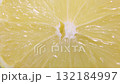The lemon fruit is cut. Lemon close-up rotates cyclically.  132184997