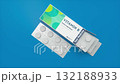 Vitamin B Supplement Box With Blister Packs on Blue Background 132188933