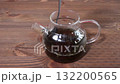 Brewing black tea in a teapot. 132200565