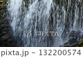 Waterfall coming down a rocky cliff. 132200574