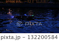 A boat sails along the Neva at night. 132200584