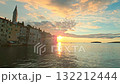 Stunning sunset view over the historic old town of Rovinj, Croatia, with famous church tower and vivid sky colors 132212444
