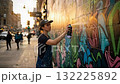 Urban Artist Capturing the Vibrancy of Street Art: A Colorful Journey of Creativity and Expression Through Spray Paint on City Walls. 132225892