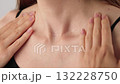 Close-up of an unrecognizable woman touching her neck line. Endocrine health prevention, treatment. Diseases of the thyroid gland. Cancer screening. Endocrinology. Medical concept Healthcare Self-care 132228750