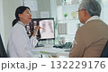 Young Asia female doctor with old man patient use clipboard for consulting, advice and medical expert at desk in health clinic office. Help, appointment support in hospital for diagnosis, physician. 132229176