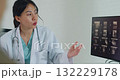 Young Asia female doctor with old man patient use clipboard for consulting, advice and medical expert at desk in health clinic office. Help, appointment support in hospital for diagnosis, physician. 132229178