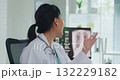 Young Asia female doctor with old man patient use clipboard for consulting, advice and medical expert at desk in health clinic office. Help, appointment support in hospital for diagnosis, physician. 132229182