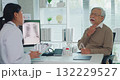 Young Asia female doctor with old man patient use clipboard for consulting, advice and medical expert at desk in health clinic office. Help, appointment support in hospital for diagnosis, physician. 132229527
