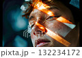 Close-up of a young man thoughtful face in artistic lighting with soft focus, symbolizing introspection, emotion, and self-reflection 132234172