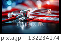 Stethoscope lying on American flag, representing national healthcare system, medicine, and public health 132234174