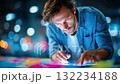 Focused man interacting with a large digital touchscreen, representing technology, innovation, and data analysis 132234188