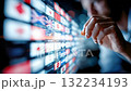 Person interacting with a touchscreen displaying multiple international flags, representing global technology, communication, and data exchange 132234193
