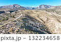 Aerial Nevada Desert Trails and Snowy Mountains Tracking Shot 132234658