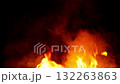 Bright flames and rising smoke of fire in darkness 132263863