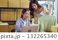 Two asian woman working on laptop and check document while managing and planning online business. 132265340