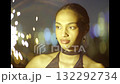 Beautiful young woman smiling with sparklers in the night, party time 132292734