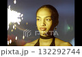 Beautiful young woman smiling with sparklers in the night, party time 132292744