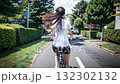 Woman cycling on a bicycle 132302132