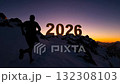 People standing on the top of a snowy mountain welcome the year 2026... 132308103