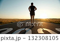 Running along the road at sunrise to welcome 2026 132308105
