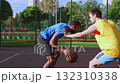 Athletic fit black male basketball player receiving assist from teammate , trying to score points with alley-oop shot while multi ethnic sports teams playing streetball game on outdoor court. Athletic fit black male basketball player receiving assist from teammate , trying to score points with alley-oop shot while multi ethnic sports teams playing streetball game on outdoor court. 132310338