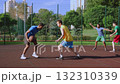Active sporty fit multiracial male basketball players playing two on two streetball game,dribbling and passing ball, trying to score points on outdoor court. Active sporty fit multiracial male basketball players playing two on two streetball game,dribbling and passing ball, trying to score points on outdoor court. 132310339