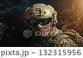 A soldier in tactical gear on a black background. 132315956