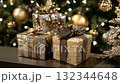 Holiday gifts arranged beautifully under a decorated Christmas tree with golden ornaments and soft lights during a festive celebration 132344648