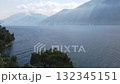 Panoramic spring view of Lake Garda with small ferry at Limone Sul Garda town 132345151