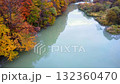 Autumn leaves reflected on the river surface 132360470